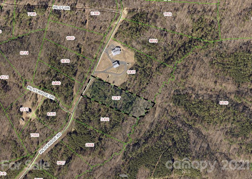402 Pilot Ridge Road, Unit 13 Nebo, NC 28761 - Photo 2 of 32 a aerial view of a house with a yard and wooden fence