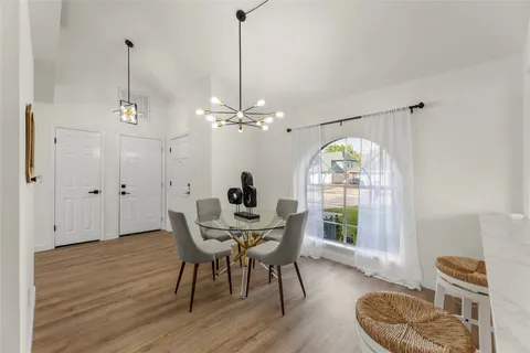 a view of a livingroom with furniture window and wooden floor