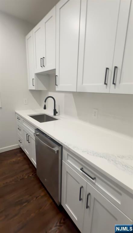 207 Valley Road, Unit 7 Clifton, NJ 07013 - Photo 3 of 8 a kitchen with granite countertop white cabinets and white appliances