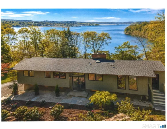 a aerial view of a house with a yard