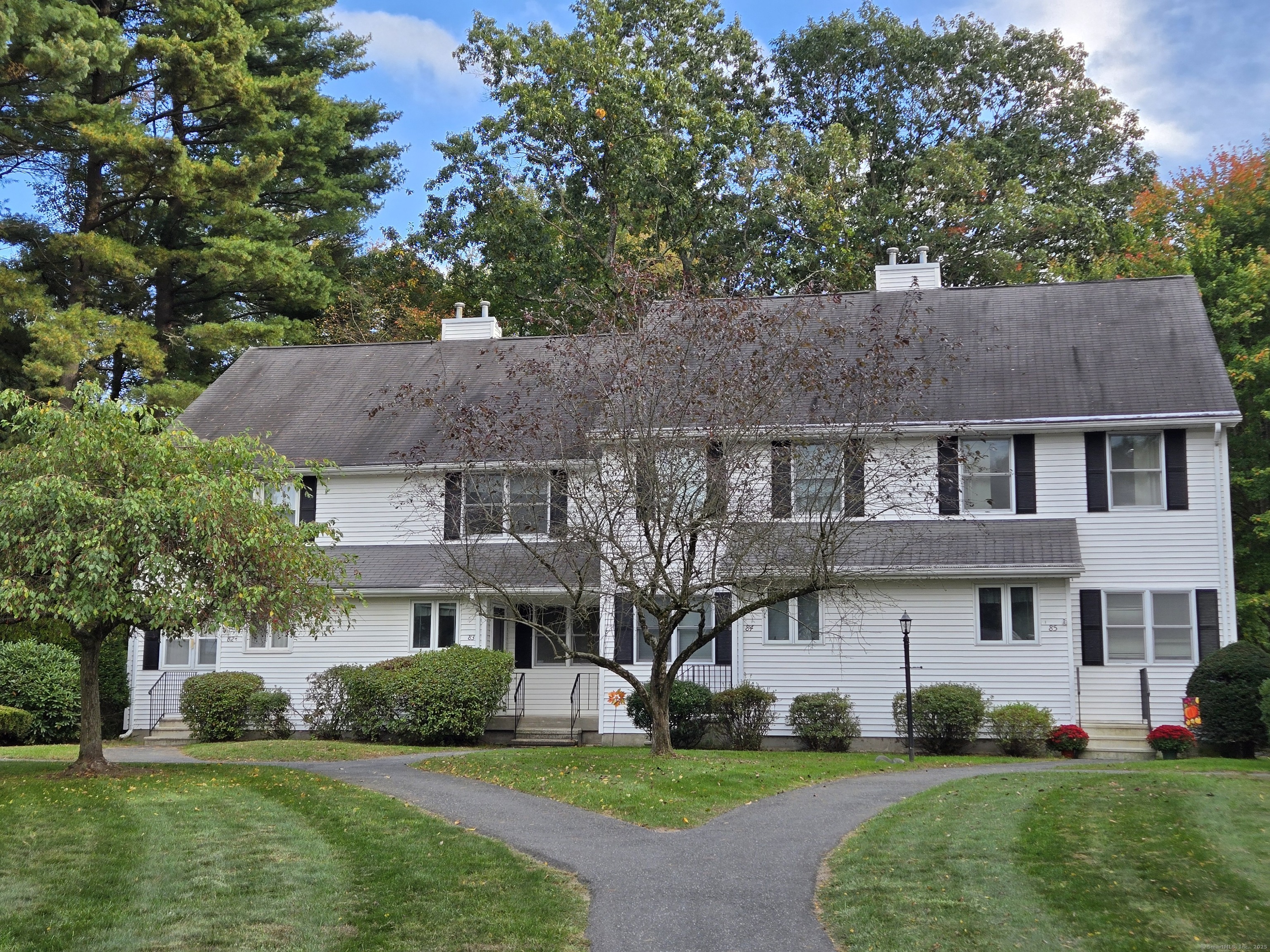 85 Oldefield Farms, Unit 85 Enfield, CT 06082 - Photo 1 of 36 a front view of a house with a yard