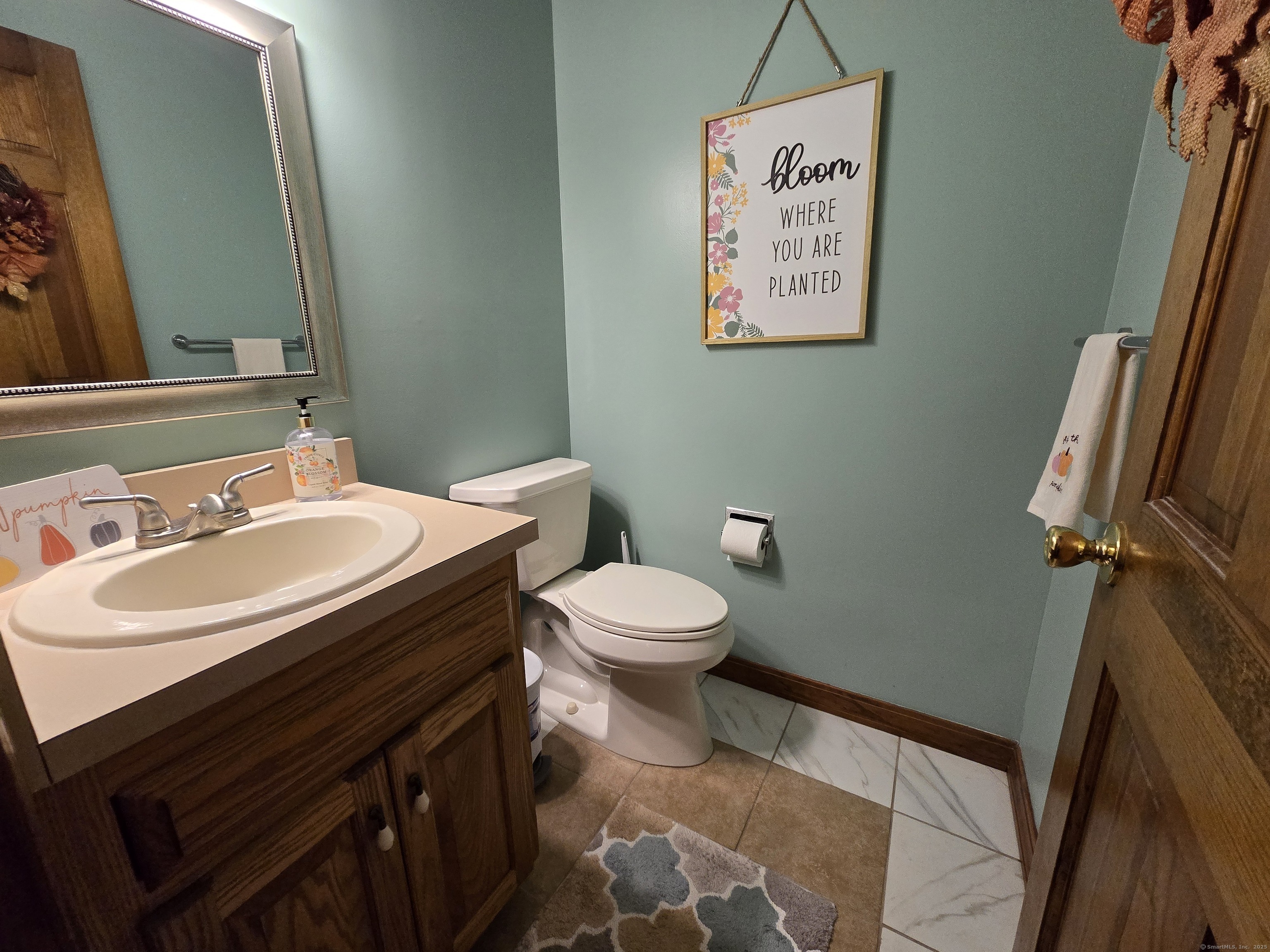 85 Oldefield Farms, Unit 85 Enfield, CT 06082 - Photo 19 of 36 a bathroom with a sink and a toilet
