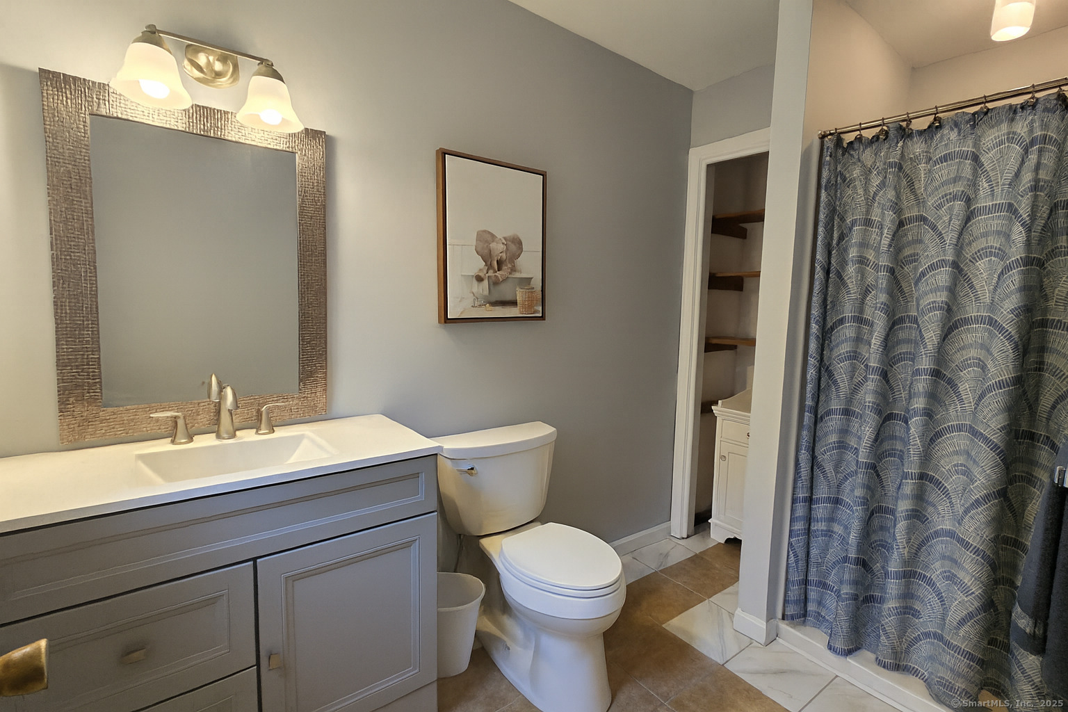85 Oldefield Farms, Unit 85 Enfield, CT 06082 - Photo 24 of 36 a bathroom with a toilet a sink and a mirror