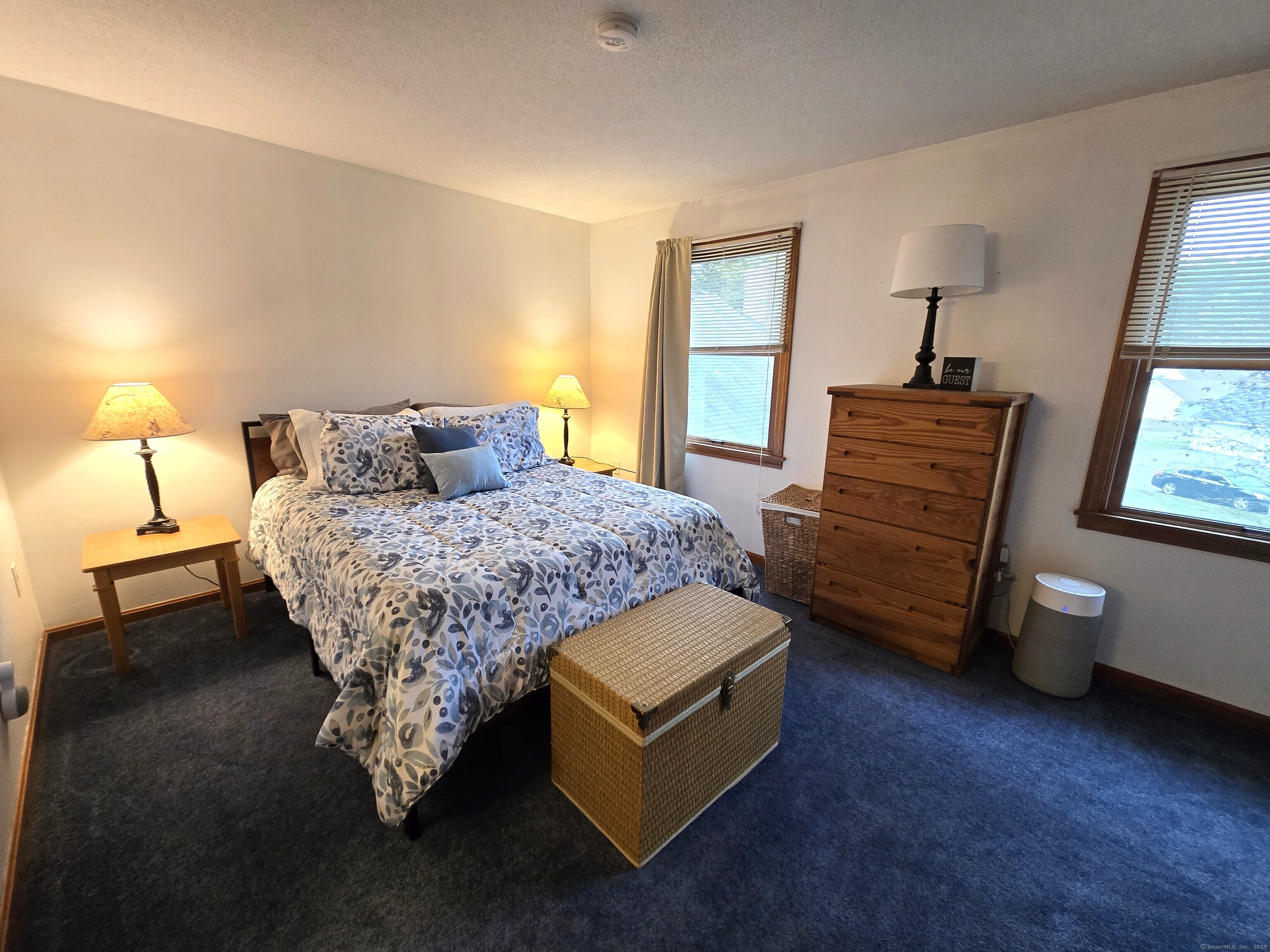 85 Oldefield Farms, Unit 85 Enfield, CT 06082 - Photo 26 of 36 a living room with furniture and a window