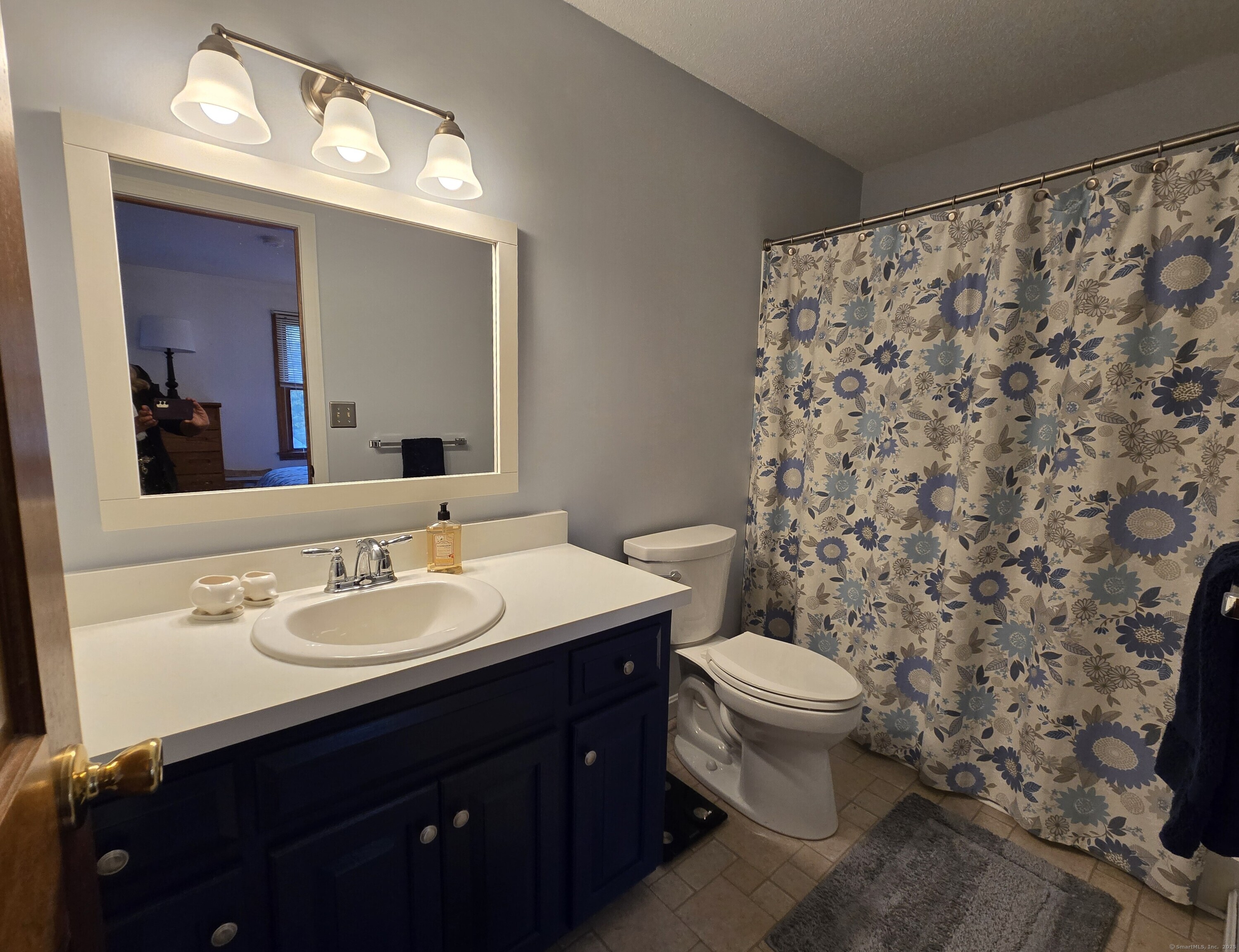 85 Oldefield Farms, Unit 85 Enfield, CT 06082 - Photo 28 of 36 a bathroom with a sink and a toilet