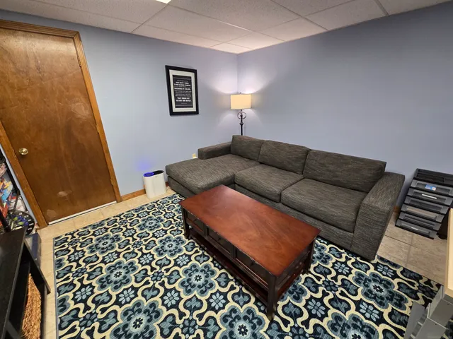 a living room with a couch and a window