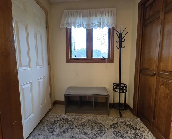 a room with furniture and a window
