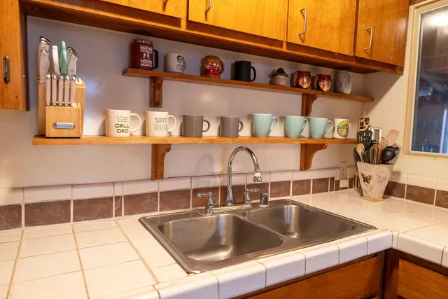 a view of backyard of house with outdoor seating