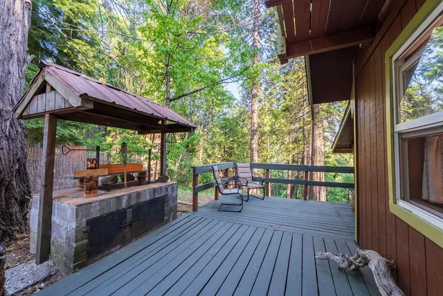 a bed sitting in a spacious bedroom next to a window