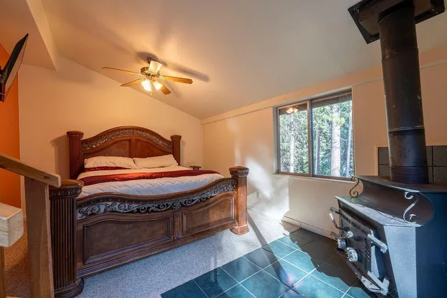 a view of a bathroom with a glass door shower and a sink