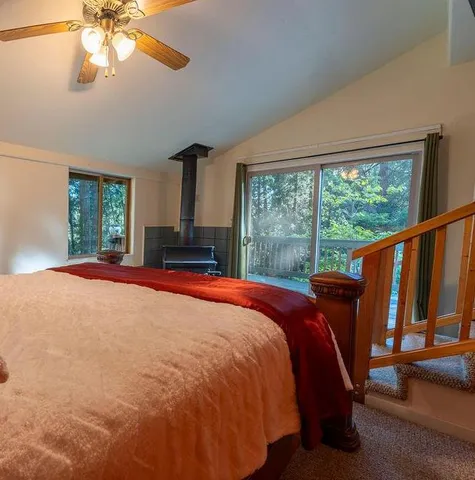 a backyard of a house with barbeque oven table and chairs