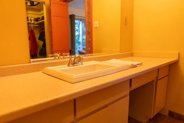 a picture of a bathroom with a sink