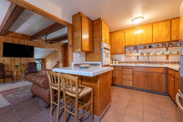 a kitchen with a sink and a stove top oven