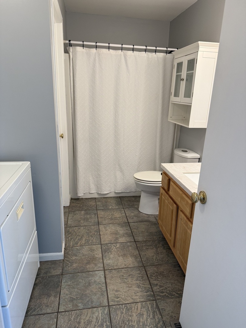 206 South 12th Street Rochelle, IL 61068 - Photo 11 of 14 a bathroom with a toilet and a shower
