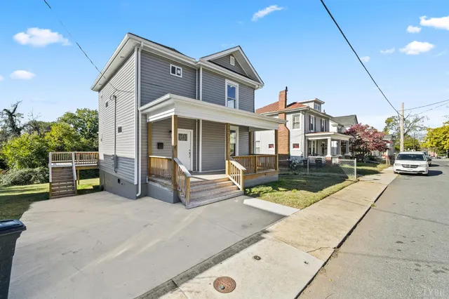 a view of a house with sitting area and furniture