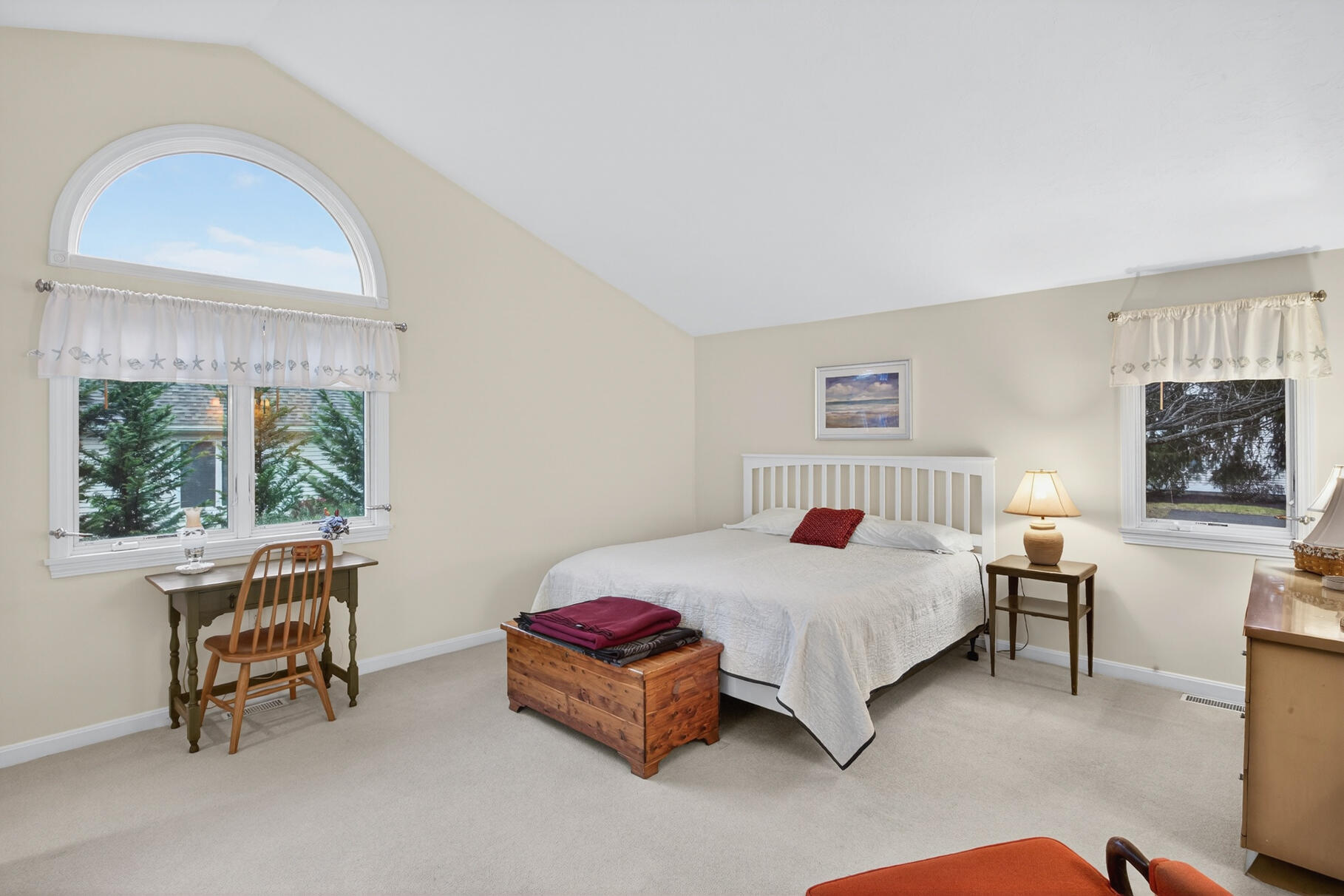 18 Windward Street, Unit 18 Mashpee, MA 02649 - Photo 18 of 34 a bedroom with a bed and a window