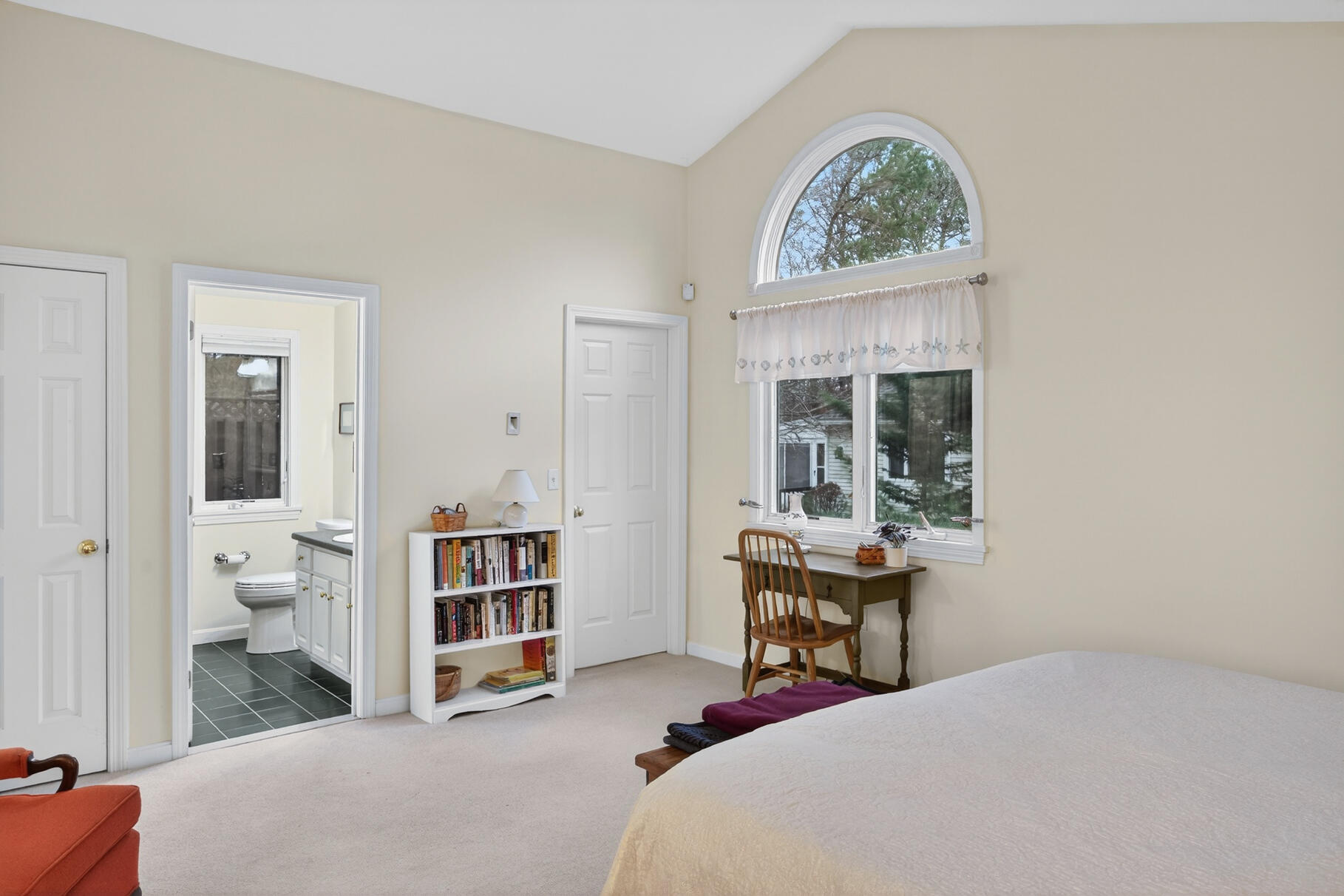 18 Windward Street, Unit 18 Mashpee, MA 02649 - Photo 20 of 34 a bedroom with a bed and large windows