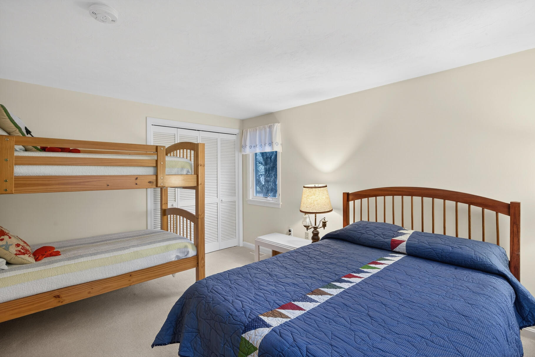 18 Windward Street, Unit 18 Mashpee, MA 02649 - Photo 26 of 34 a bedroom with a bed and a view of balcony