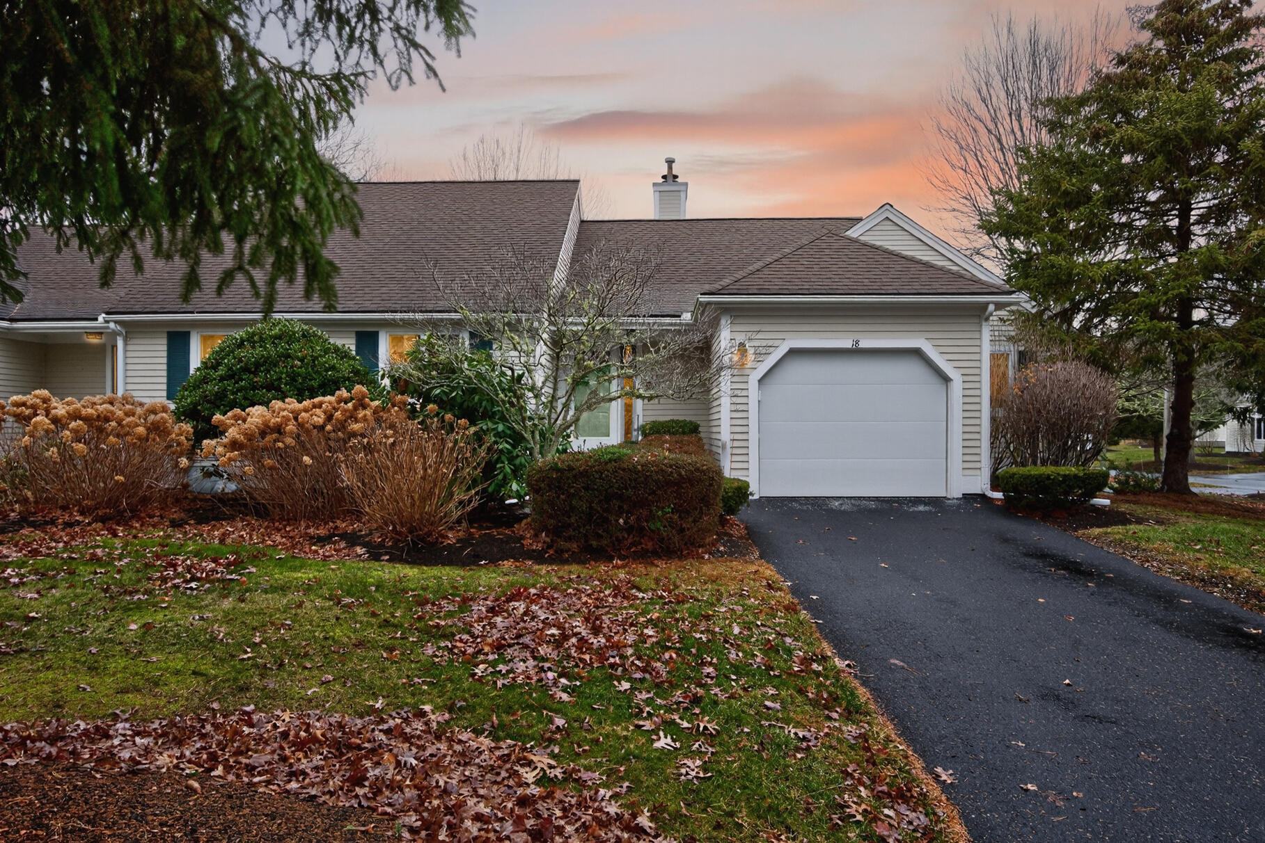 18 Windward Street, Unit 18 Mashpee, MA 02649 - Photo 30 of 34 a front view of a house with a garden