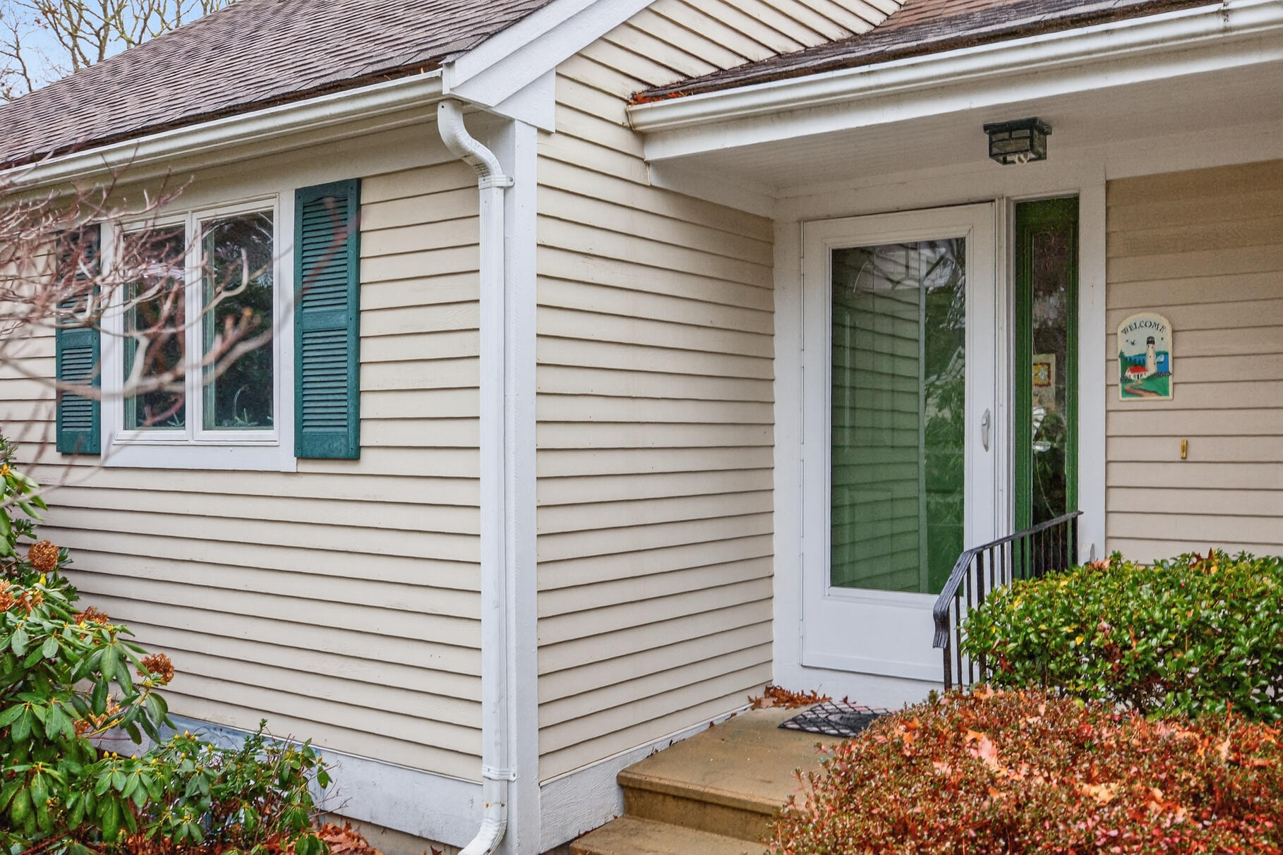 18 Windward Street, Unit 18 Mashpee, MA 02649 - Photo 7 of 34 a view of a house with potted plants
