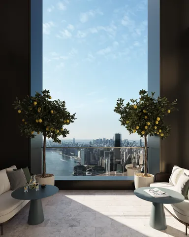 a view of a living room with furniture and a floor to ceiling window