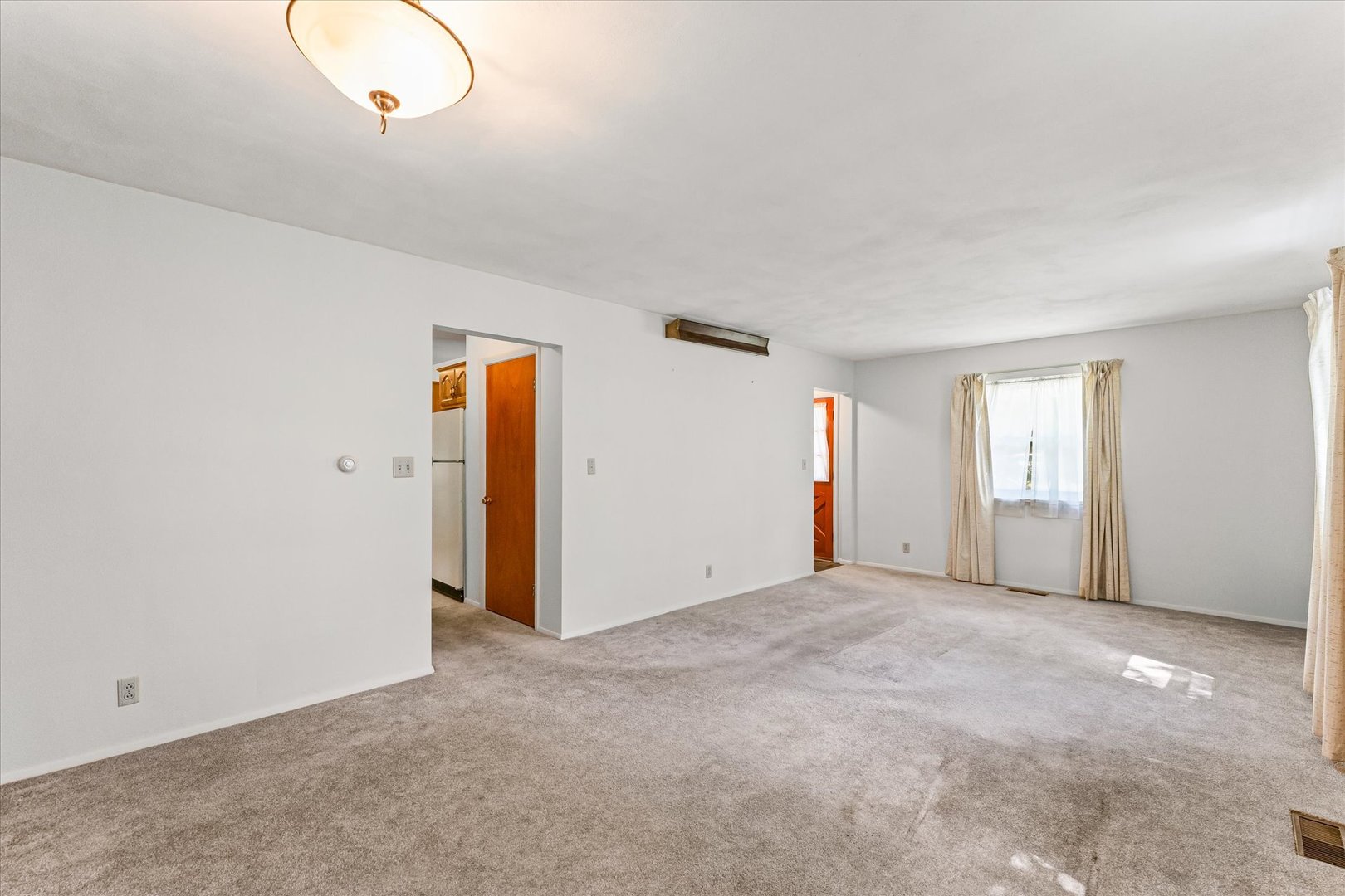1007 Holiday Drive Champaign, IL 61821 - Photo 11 of 36 a view of an empty room with wooden floor