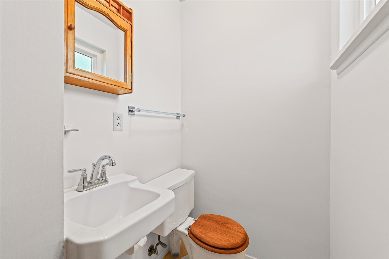 1007 Holiday Drive Champaign, IL 61821 - Photo 18 of 36 a bathroom with a sink a toilet and a mirror