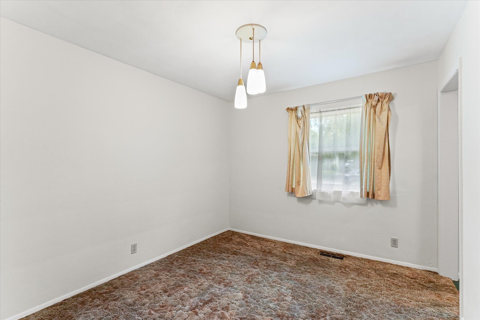 1007 Holiday Drive Champaign, IL 61821 - Photo 19 of 36 an empty room with windows