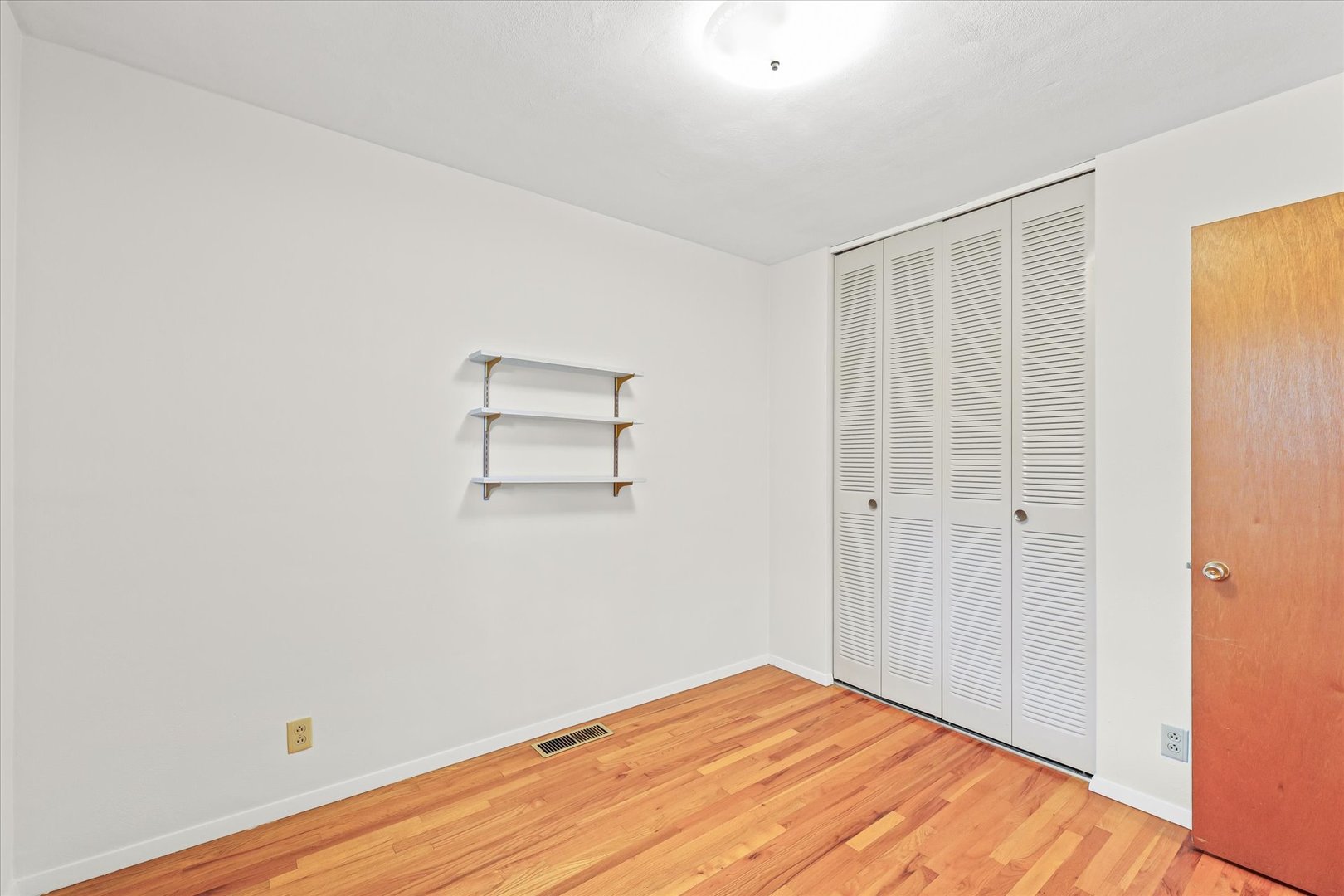1007 Holiday Drive Champaign, IL 61821 - Photo 27 of 36 a view of empty room with wooden floor