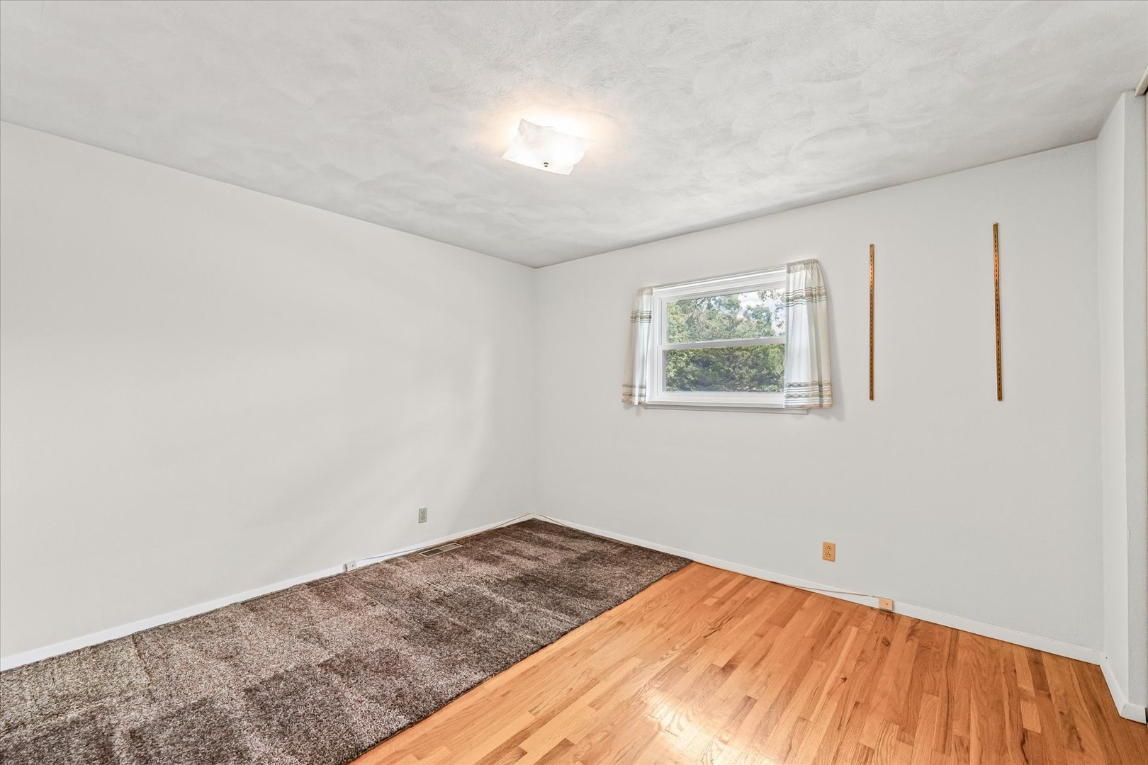 1007 Holiday Drive Champaign, IL 61821 - Photo 28 of 36 a view of a room with wooden floor and closet