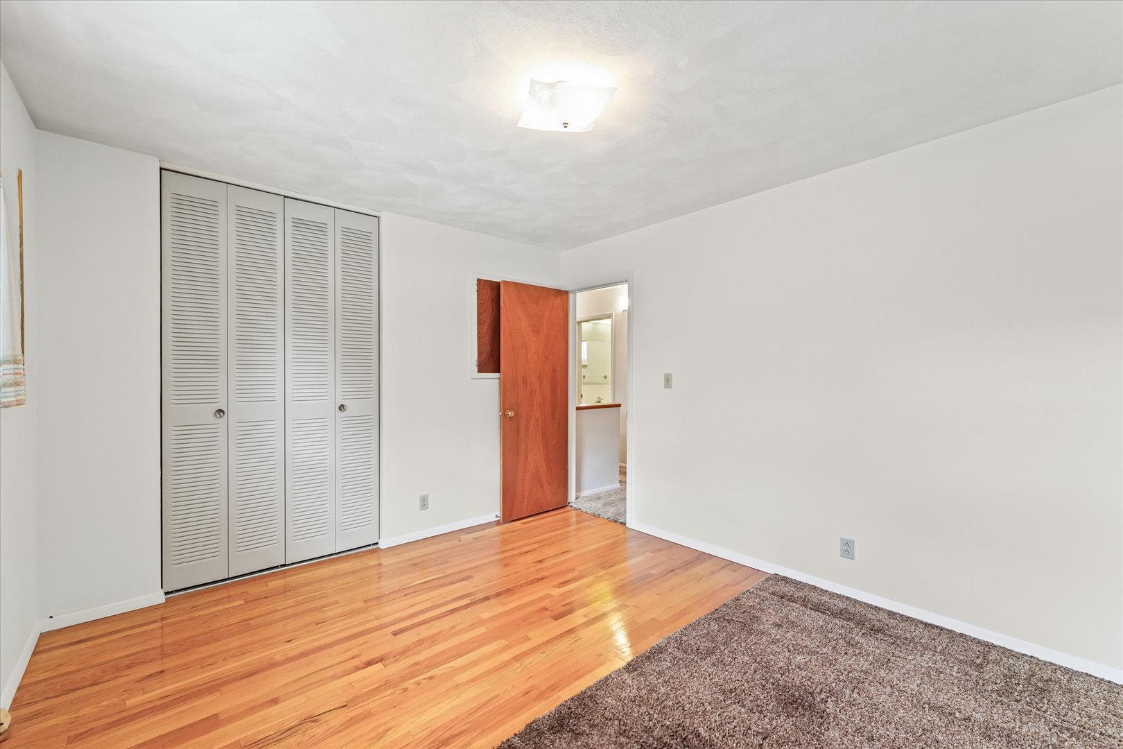 1007 Holiday Drive Champaign, IL 61821 - Photo 29 of 36 a view of empty room with wooden floor