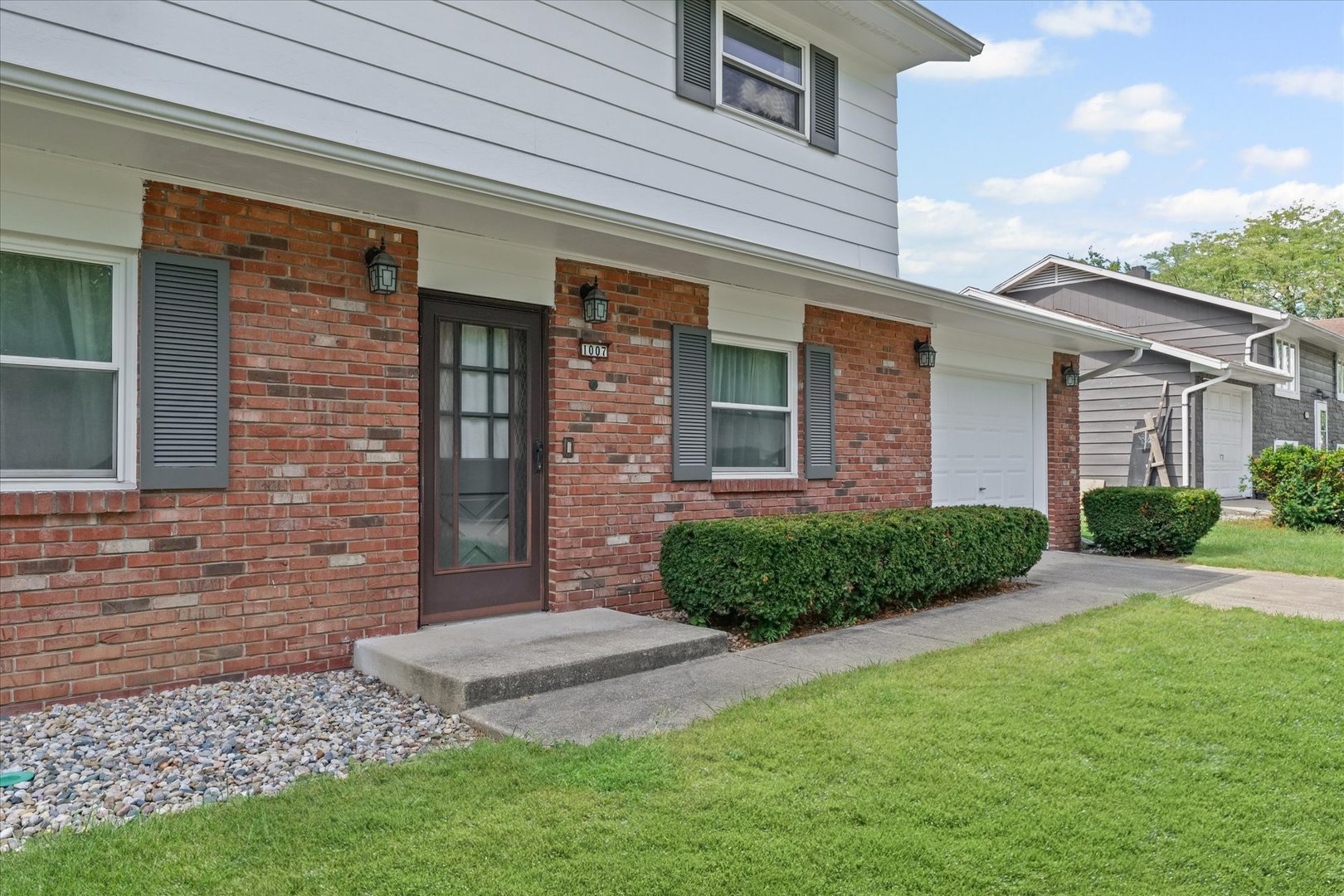 1007 Holiday Drive Champaign, IL 61821 - Photo 6 of 36 a front view of a house with a yard