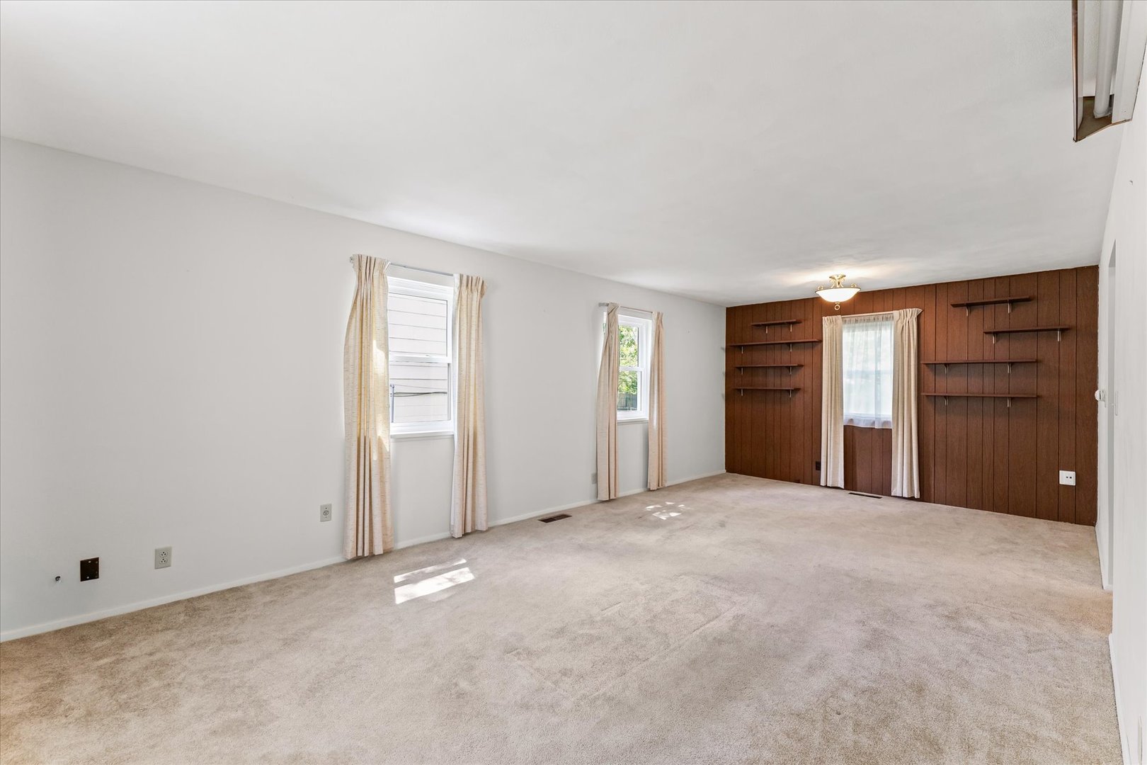1007 Holiday Drive Champaign, IL 61821 - Photo 9 of 36 an empty room with closet and natural light