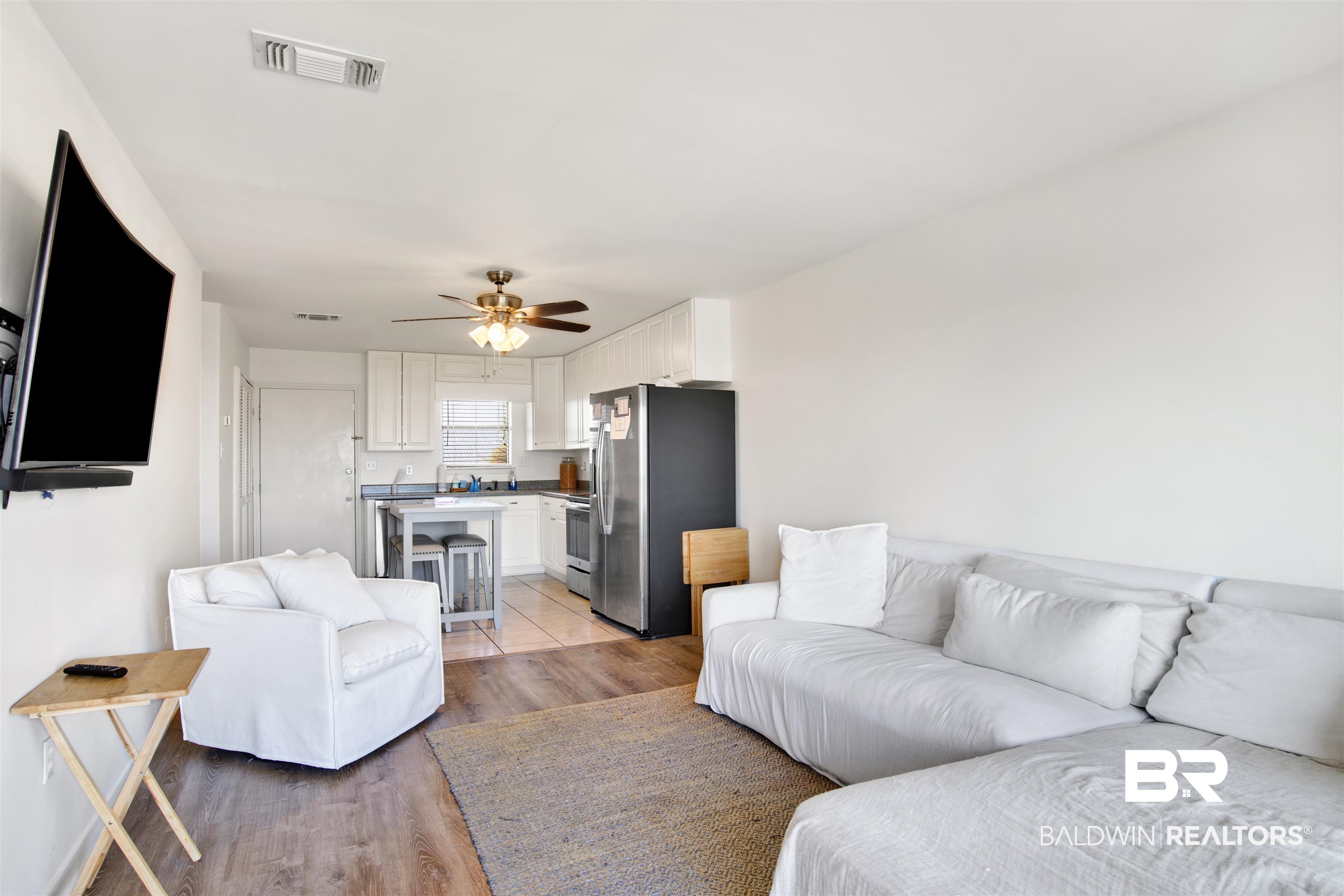 26913 Marina Road, Unit 213 Orange Beach, AL 36561 - Photo 5 of 30 Living room with ceiling fan and wood-type flooring