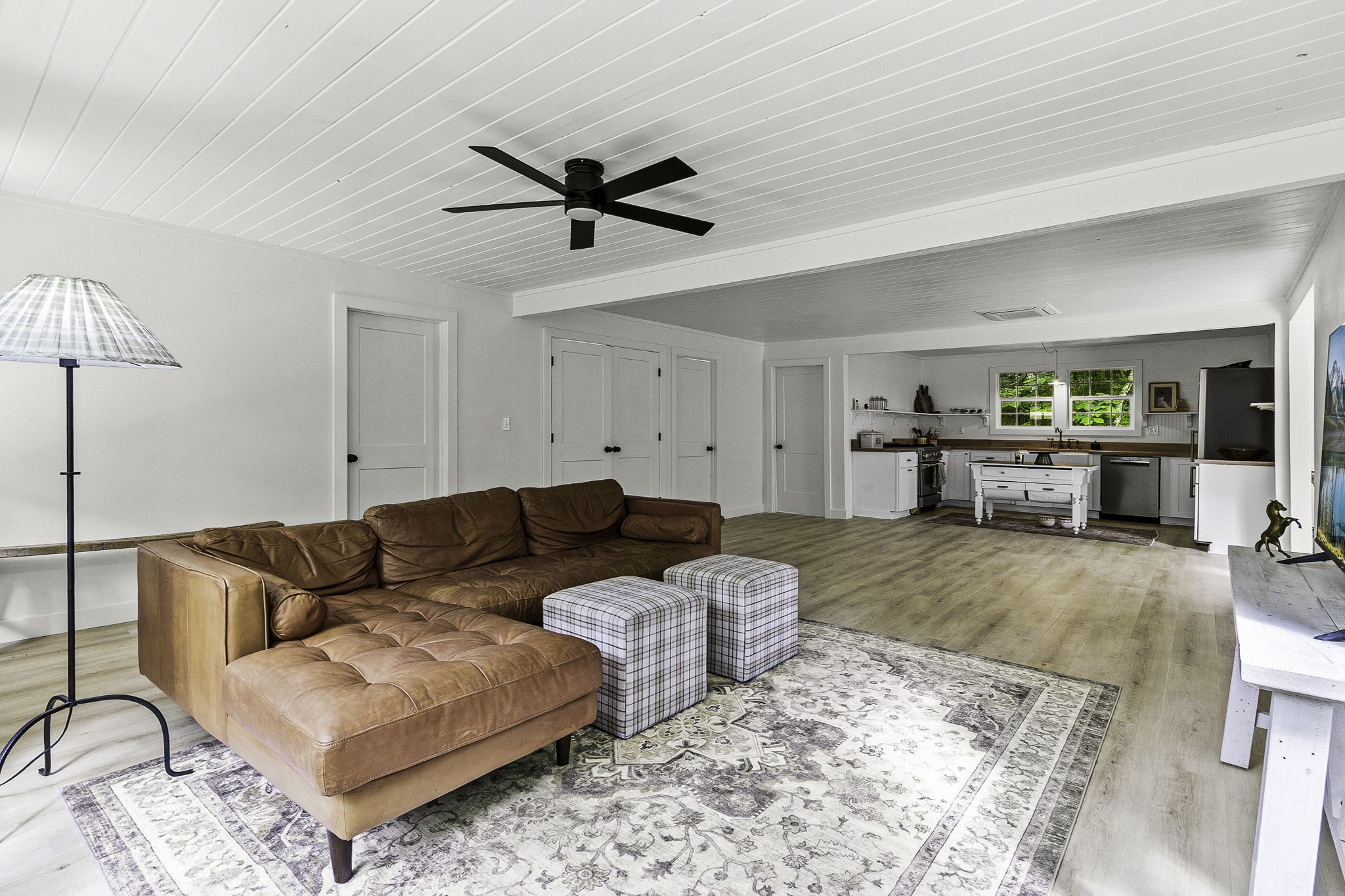 600 Wilderness Road Point Blank, TX 77364 - Photo 5 of 28 Step inside to an open-concept living space filled with natural light, warm wood tones, and a relaxed modern cottage charm.