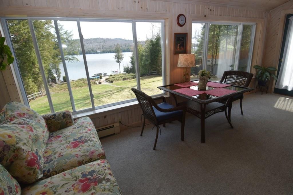 1717 Embden Pond Road Embden, ME 04958 - Photo 5 of 42 Sunroom with a view