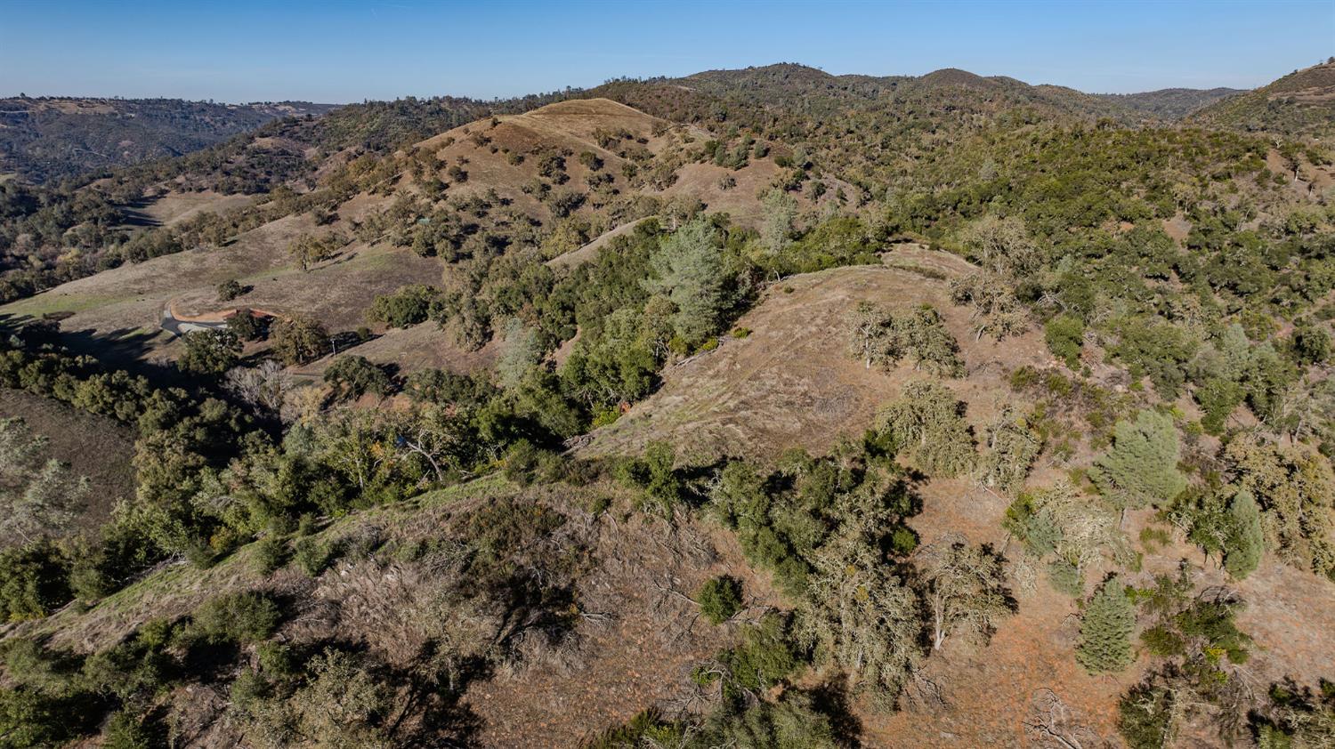 71 Hawver Road San Andreas, CA 95249 - Photo 40 of 96 a view of a mountain in the distance in a field