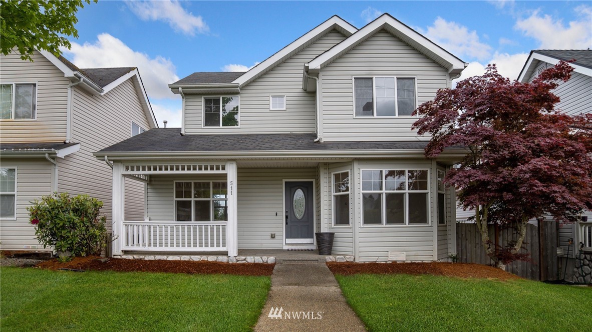 511 Redmond Place Northeast Renton, WA 98056 - Photo 1 of 31 a front view of a house with a garden