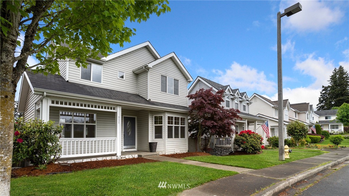 511 Redmond Place Northeast Renton, WA 98056 - Photo 2 of 31 a front view of a house with a garden