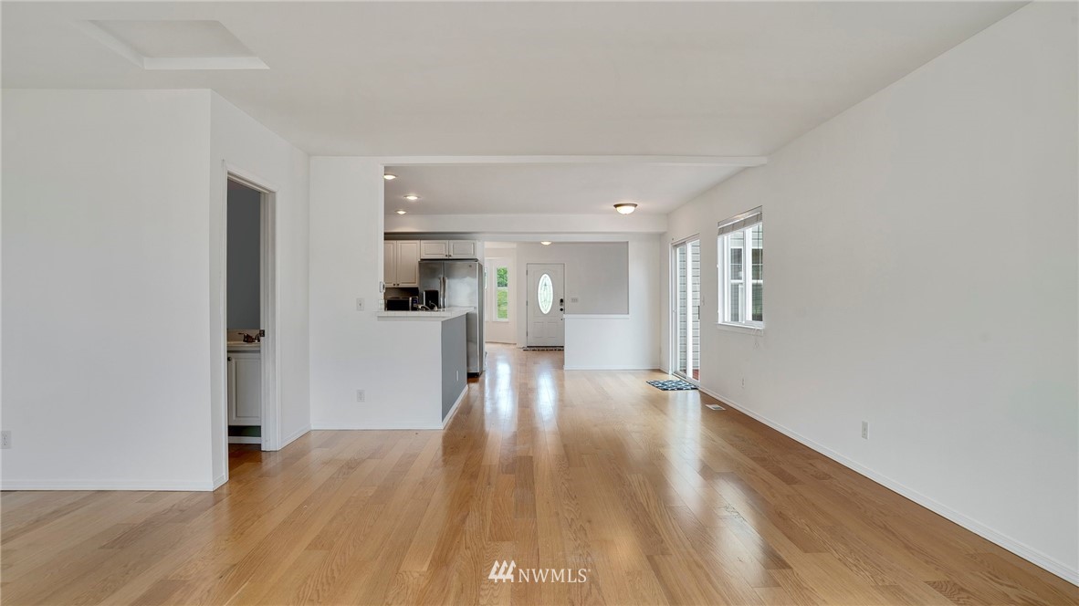 511 Redmond Place Northeast Renton, WA 98056 - Photo 14 of 31 a view of empty room with wooden floor