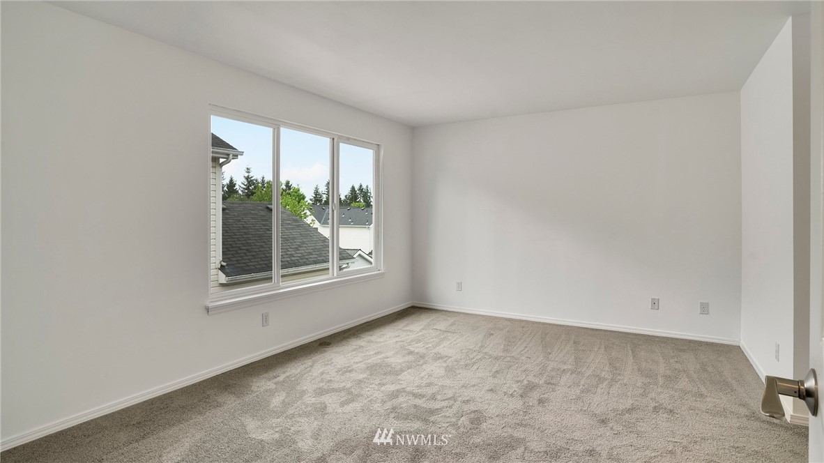 511 Redmond Place Northeast Renton, WA 98056 - Photo 18 of 31 an empty room with windows