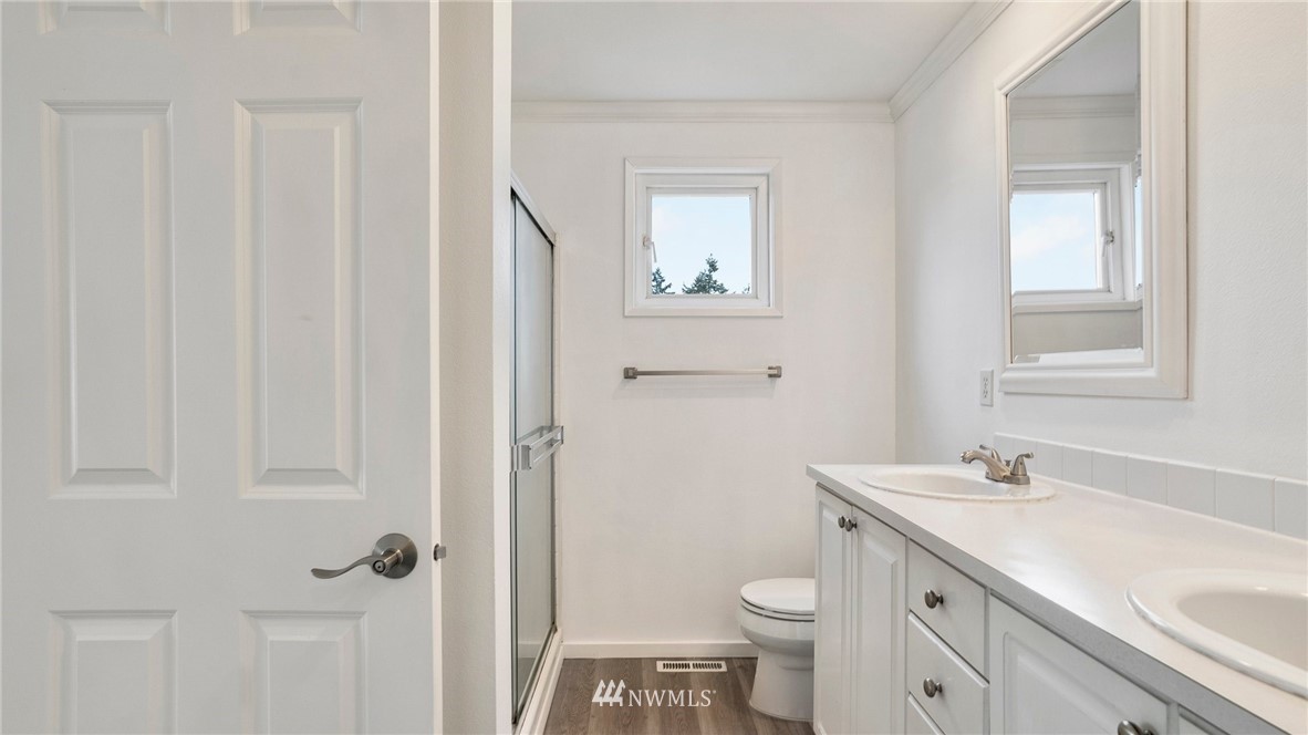 511 Redmond Place Northeast Renton, WA 98056 - Photo 20 of 31 a bathroom with a sink a toilet and shower
