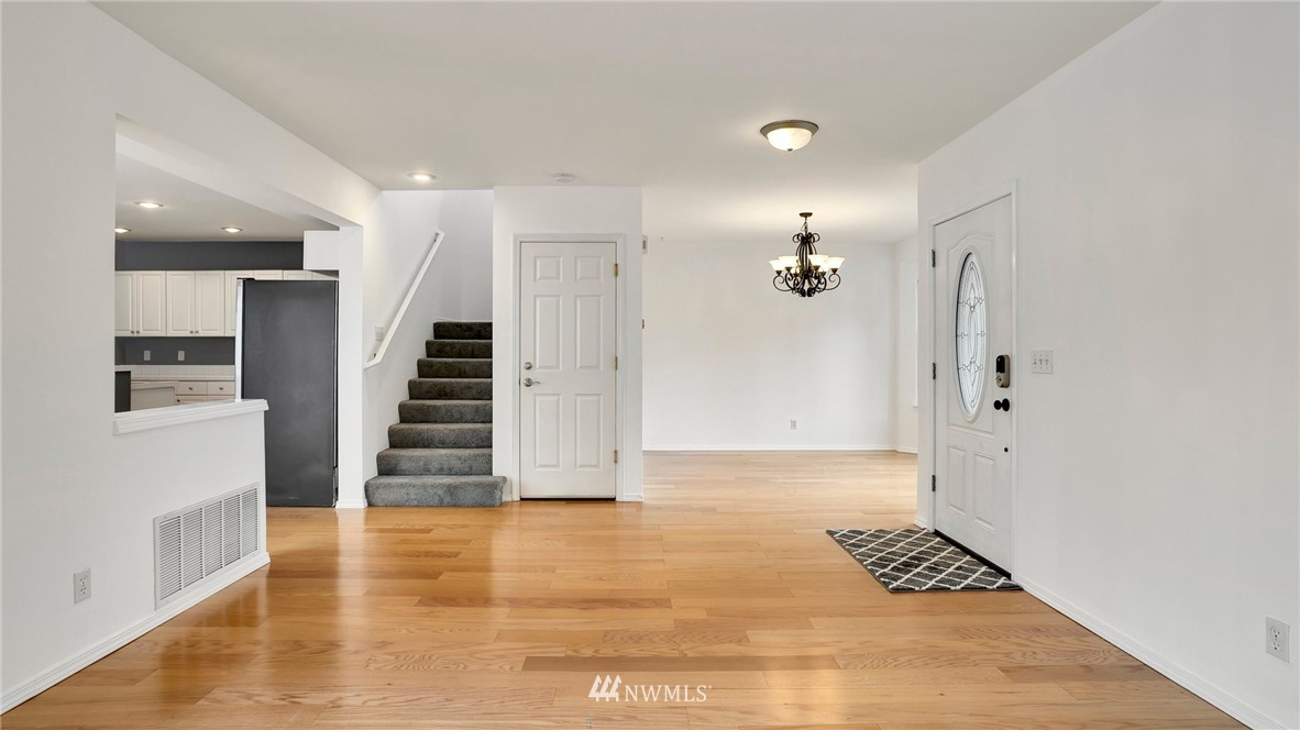 511 Redmond Place Northeast Renton, WA 98056 - Photo 5 of 31 a view of an empty room with stairs and ventilation