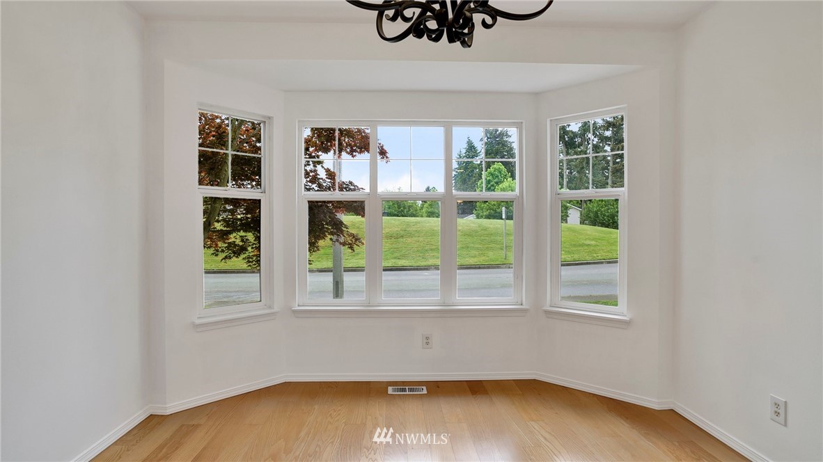 511 Redmond Place Northeast Renton, WA 98056 - Photo 7 of 31 a view of room with window and hardwood floor