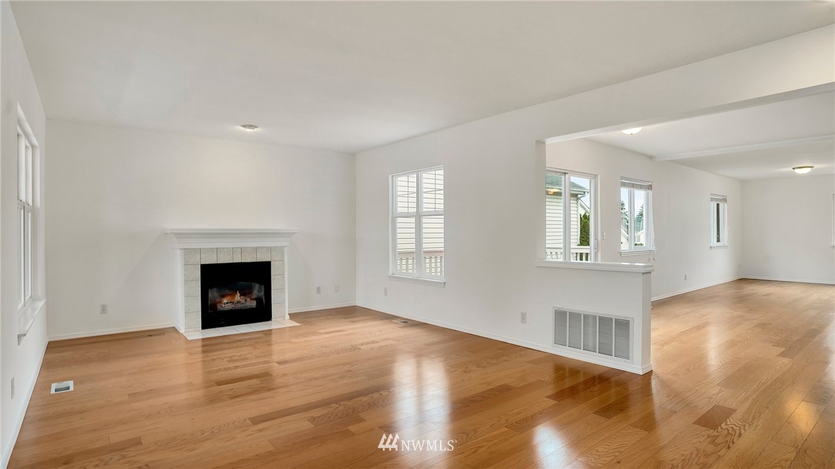 511 Redmond Place Northeast Renton, WA 98056 - Photo 8 of 31 a view of an empty room with window and fireplace