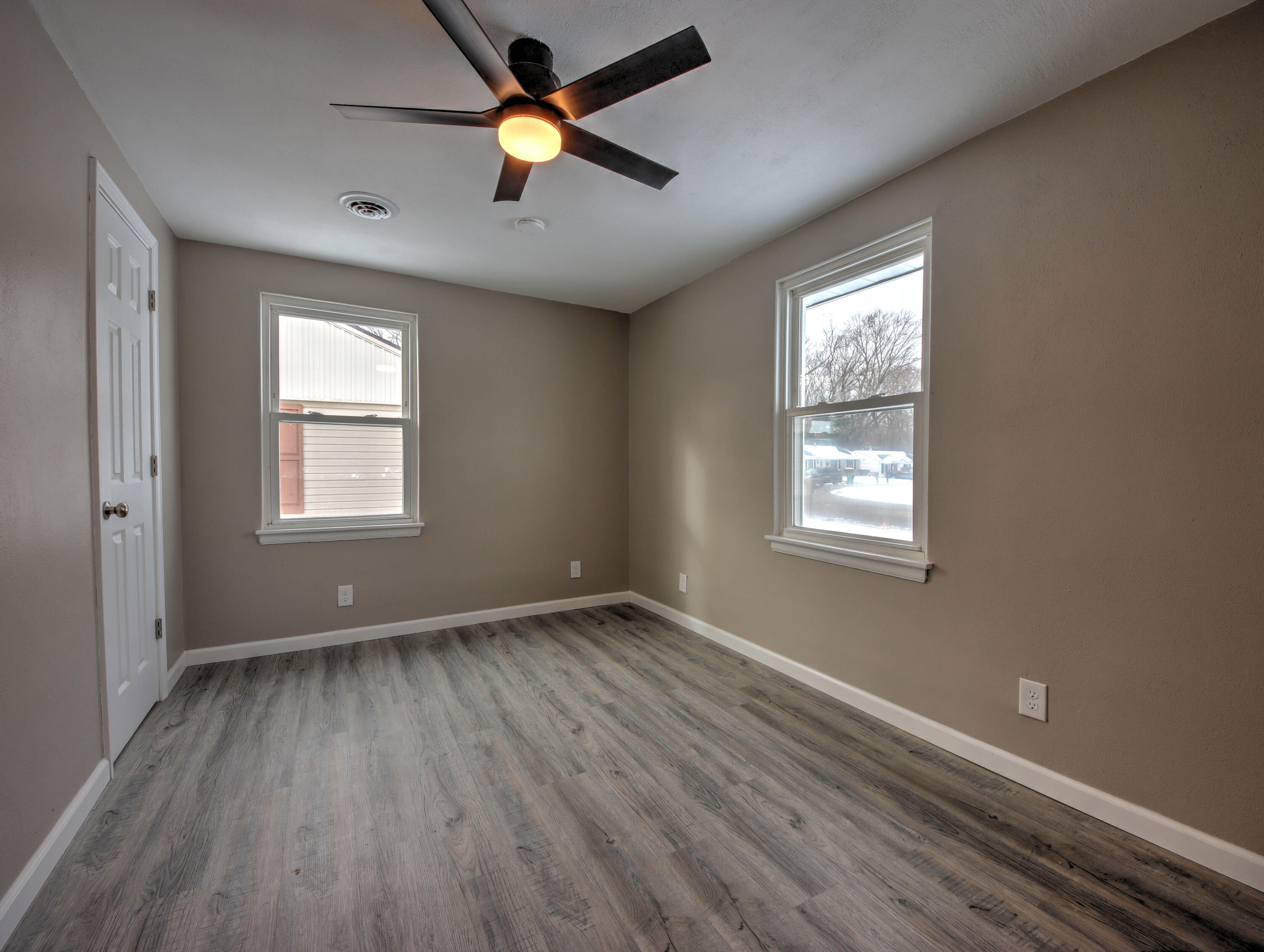 1663 Stone Lake Drive La Porte, IN 46350 - Photo 14 of 22 an empty room with window and wooden floor