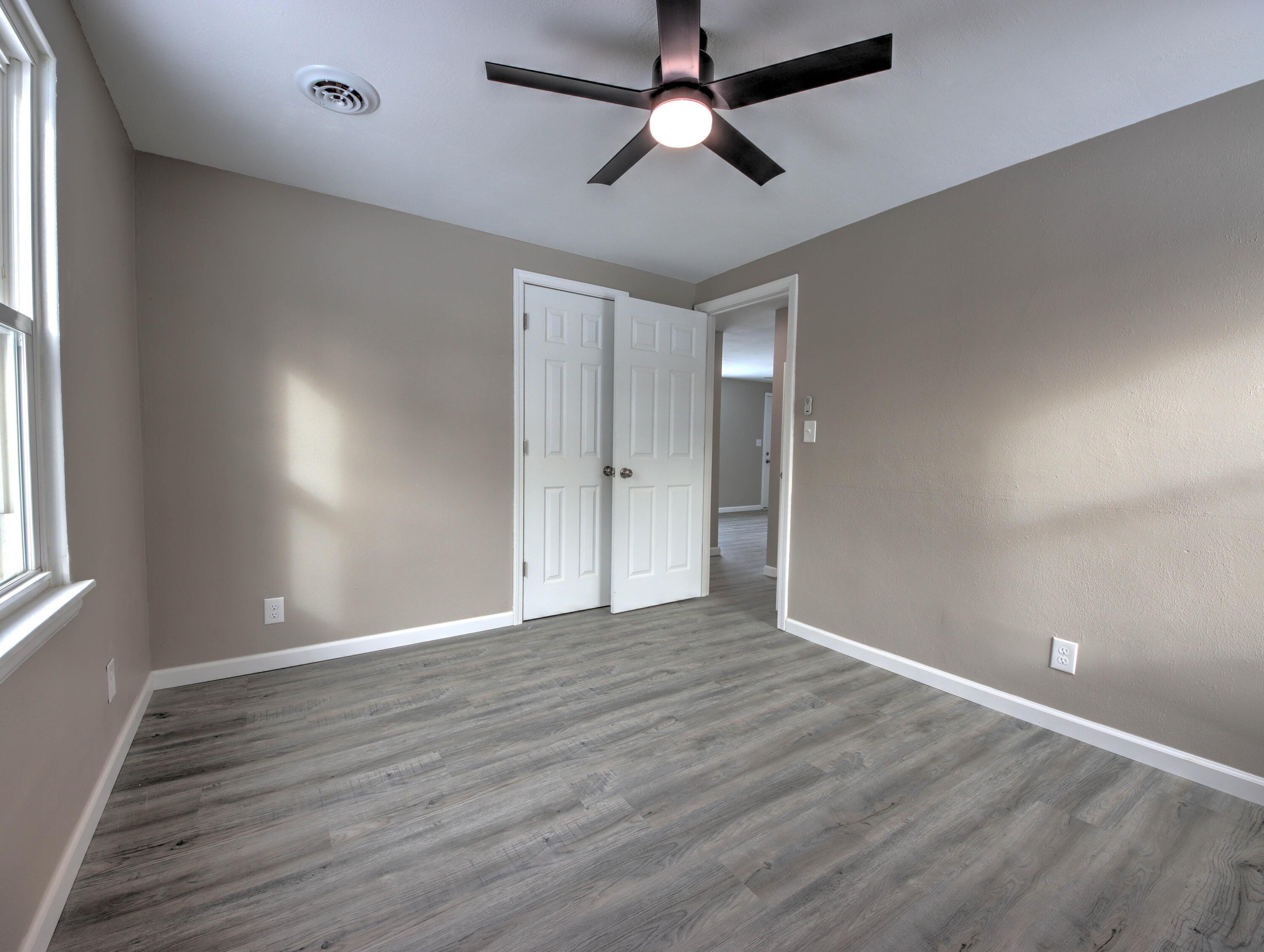 1663 Stone Lake Drive La Porte, IN 46350 - Photo 15 of 22 wooden floor in an empty room with a window