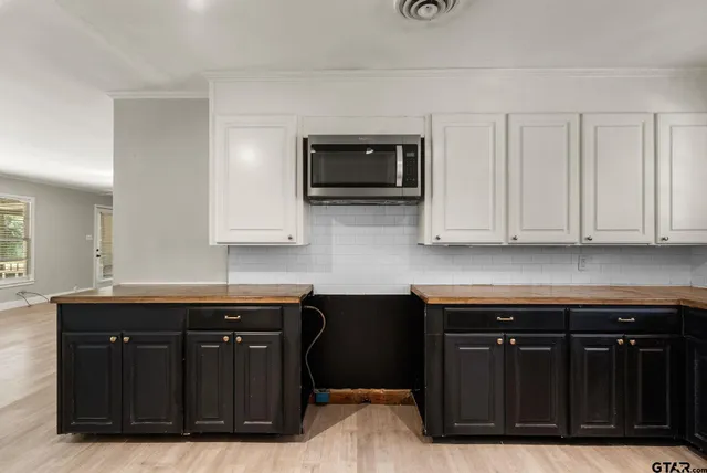 a kitchen with stainless steel appliances granite countertop a cabinets and a sink