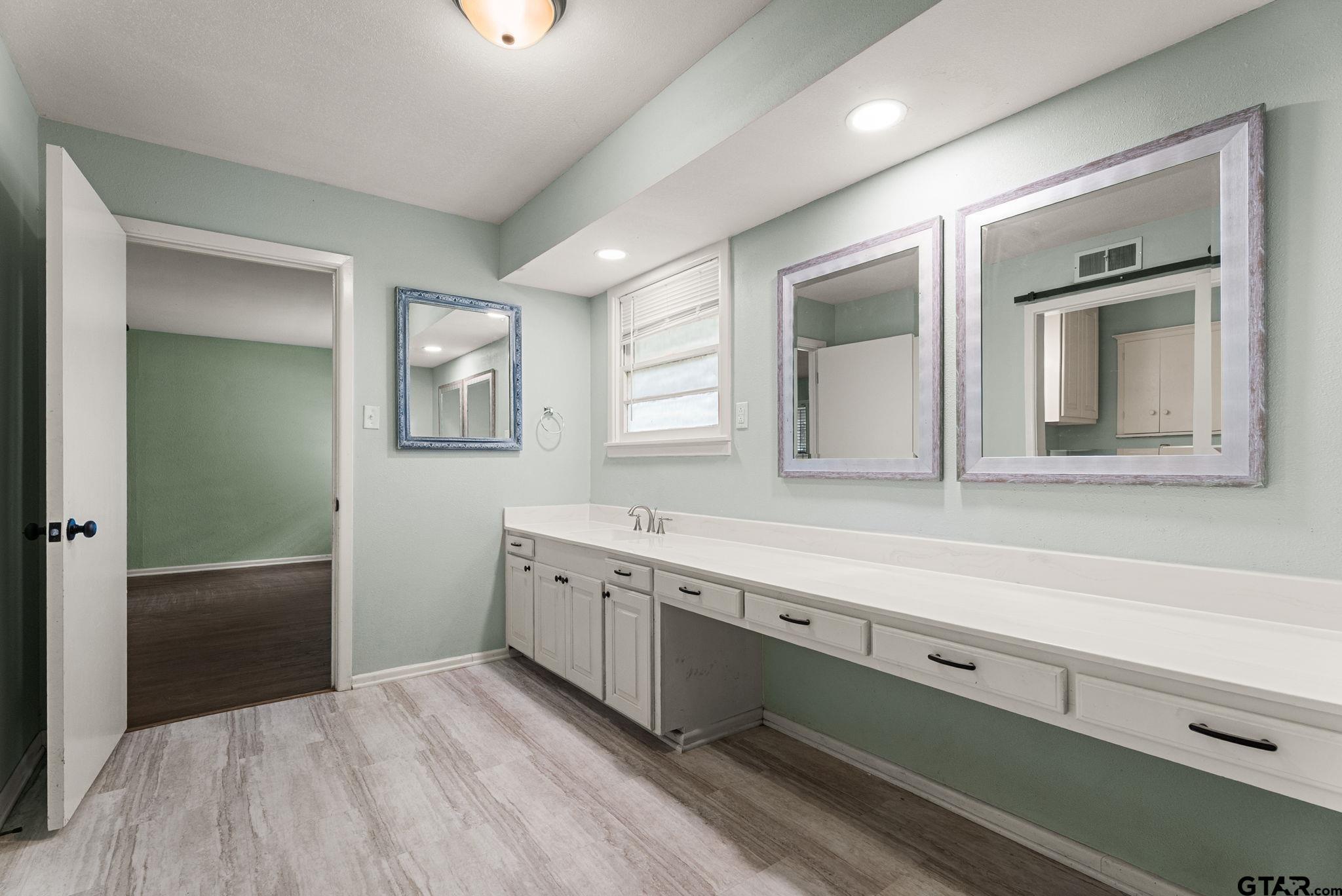 150 Wightman Lane Rusk, TX 75785 - Photo 14 of 38 a bathroom with a sink and a mirror