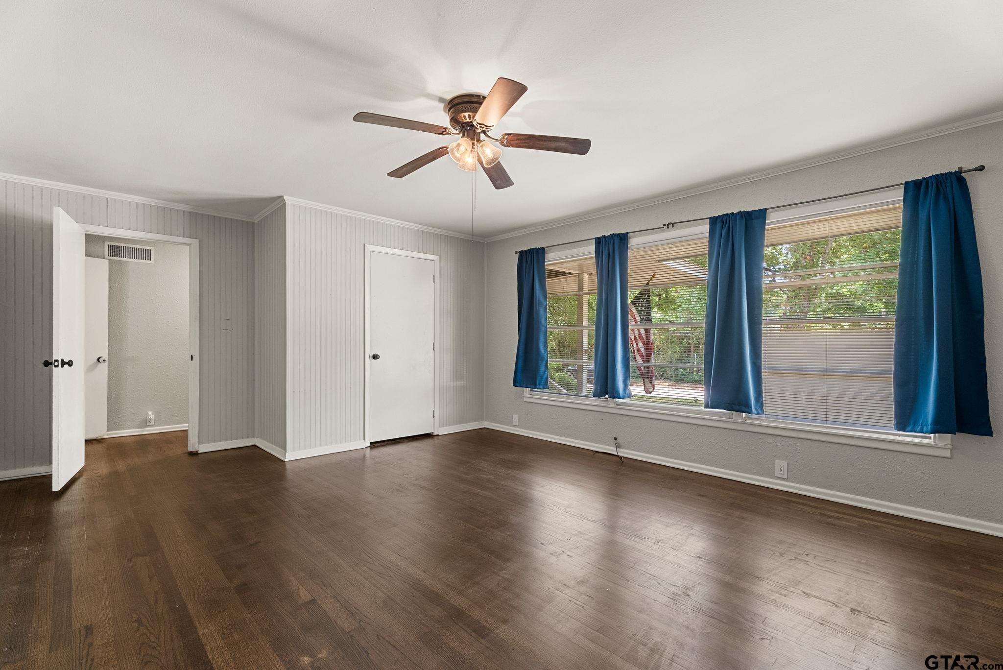 150 Wightman Lane Rusk, TX 75785 - Photo 18 of 38 a view of an empty room with wooden floor and a window
